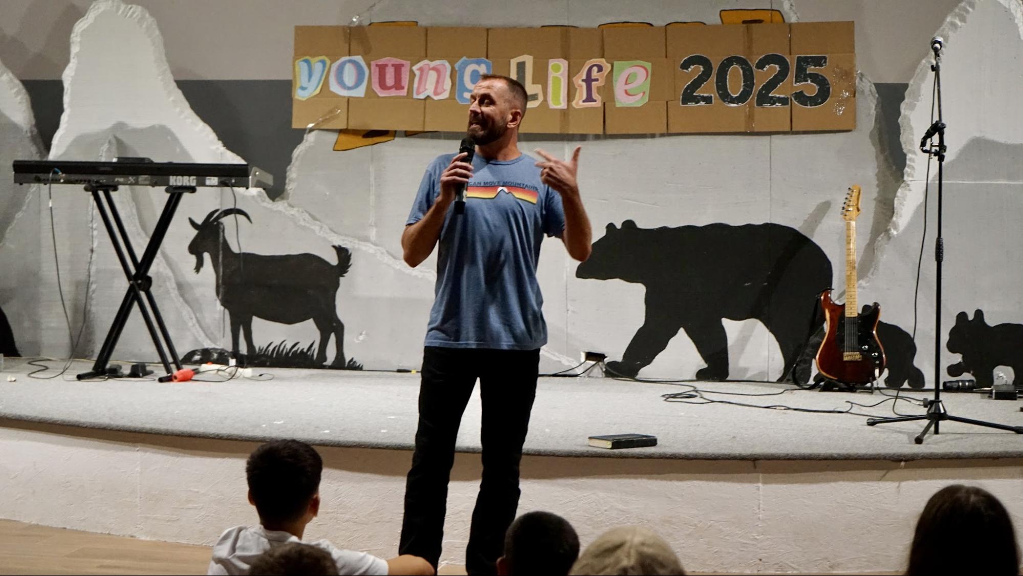 Speaker addressing students at a Young Life 2025 gathering