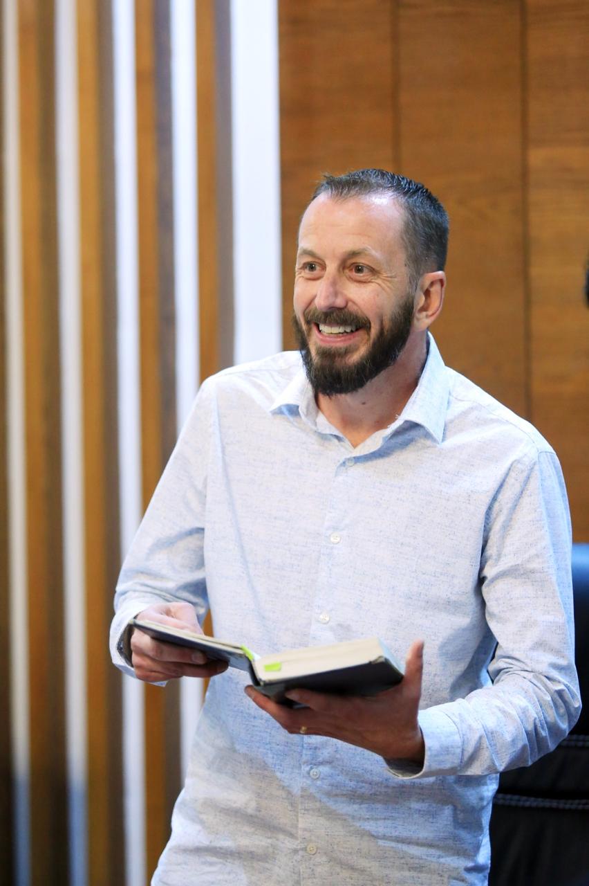 A pastor teaching from Scripture in Pakistan