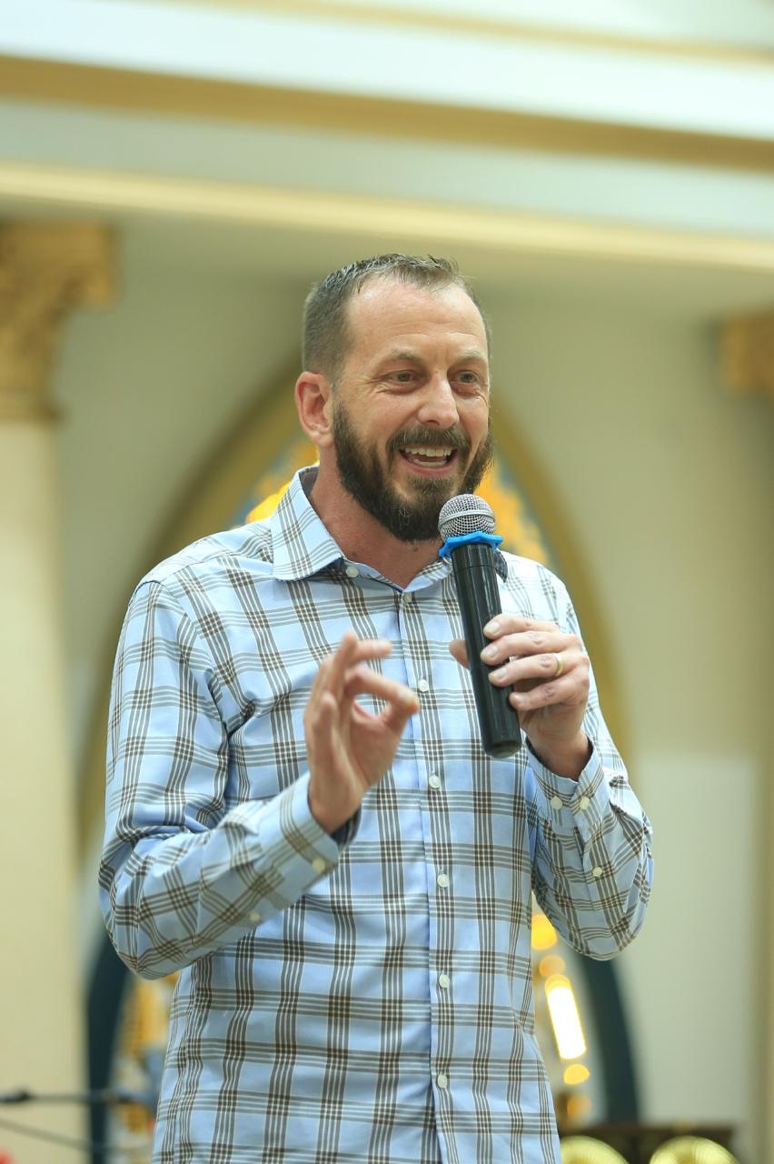 A pastor sharing the Gospel with a microphone in Pakistan