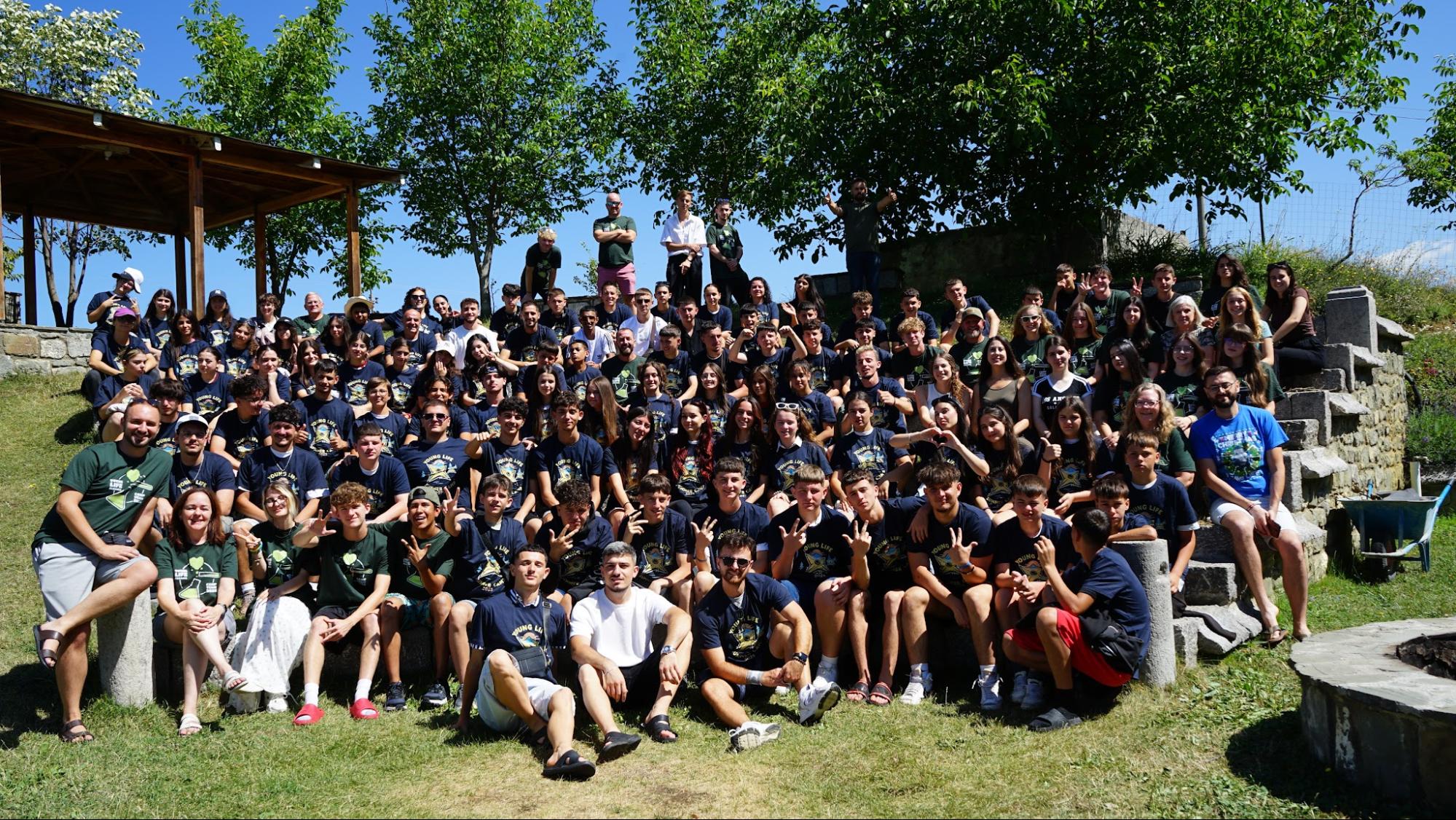 Large group photo of students and leaders at a summer youth camp