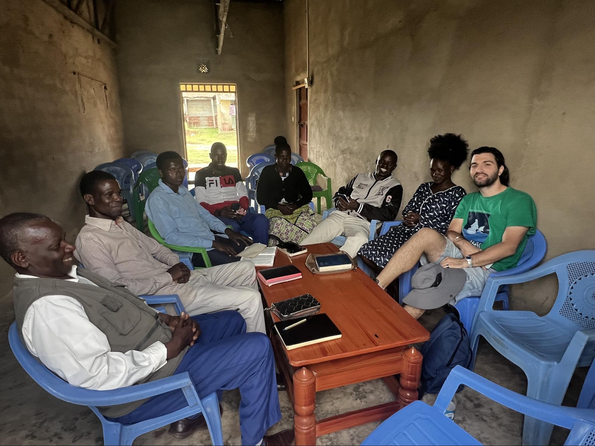 Leaders gathered around a table for Bible study