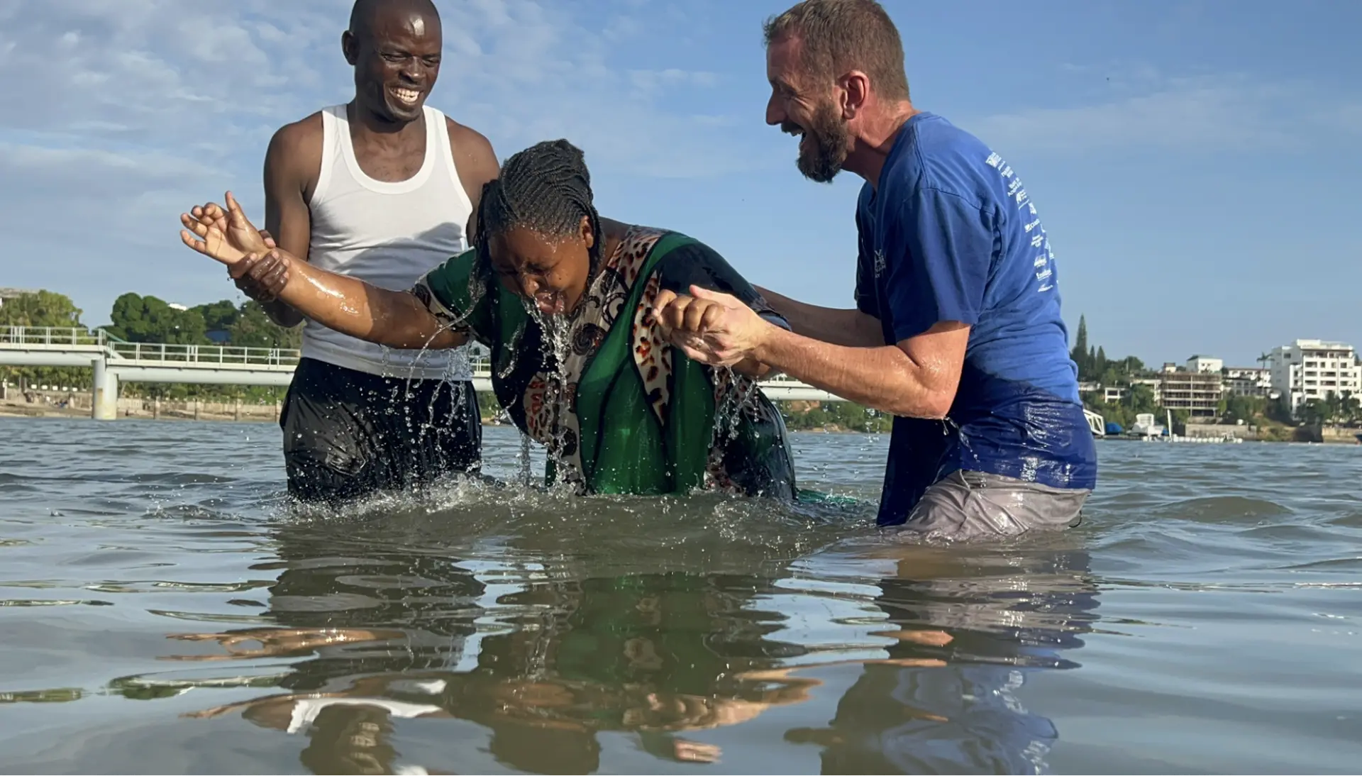 Baptism in the lake with joyful believers