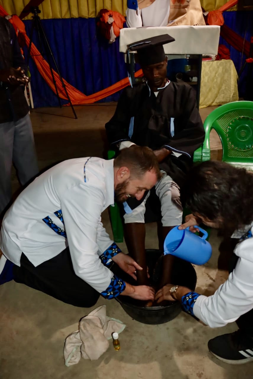 Foot washing during a graduation and commissioning service