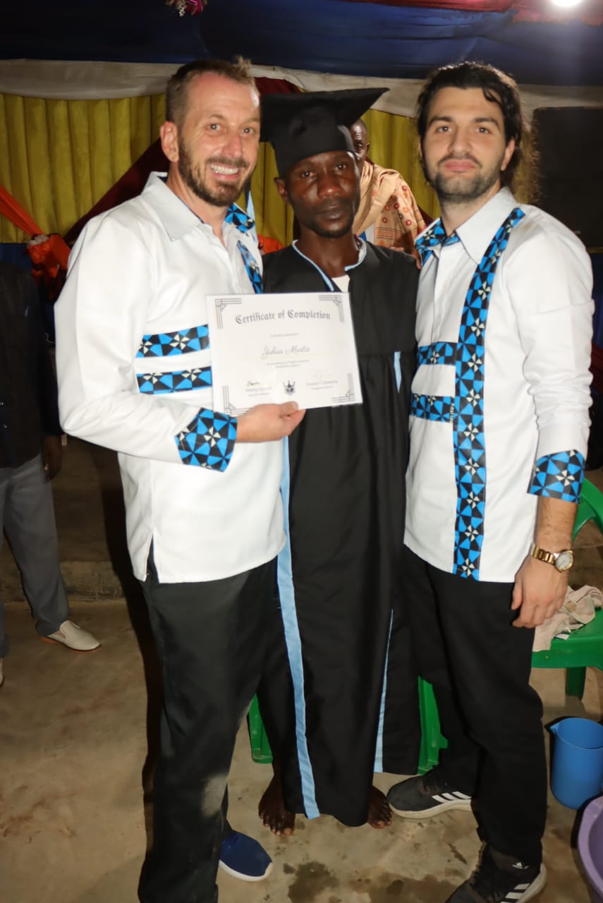 Ministry school graduate holding his certificate of completion