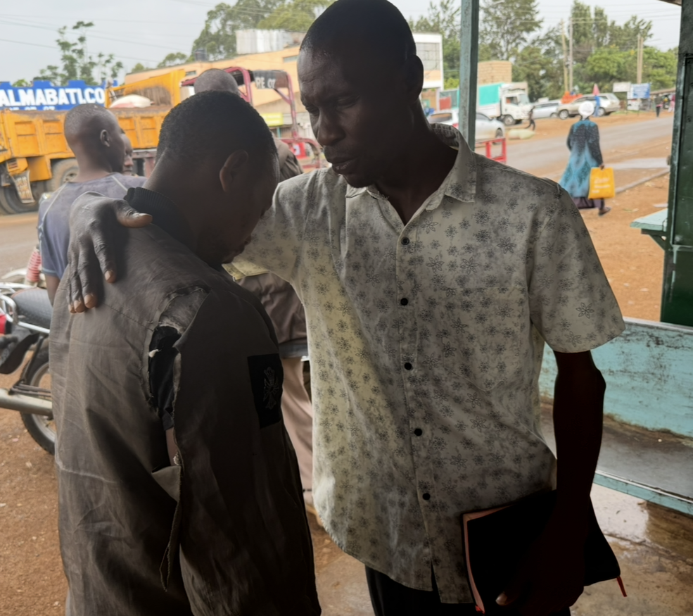 Close-up of prayer over a man in the marketplace