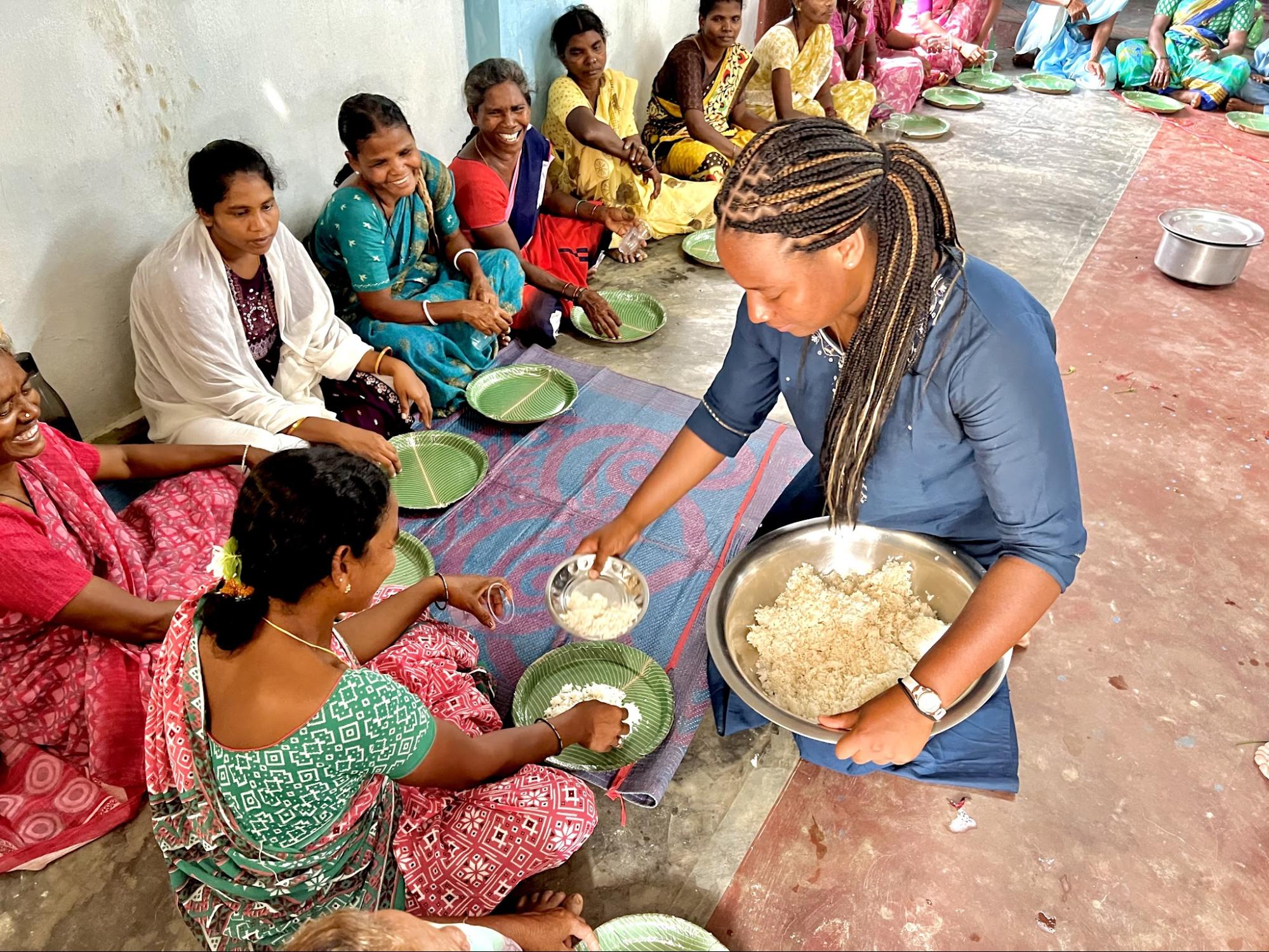 Serving rice to widows gathered for a meal