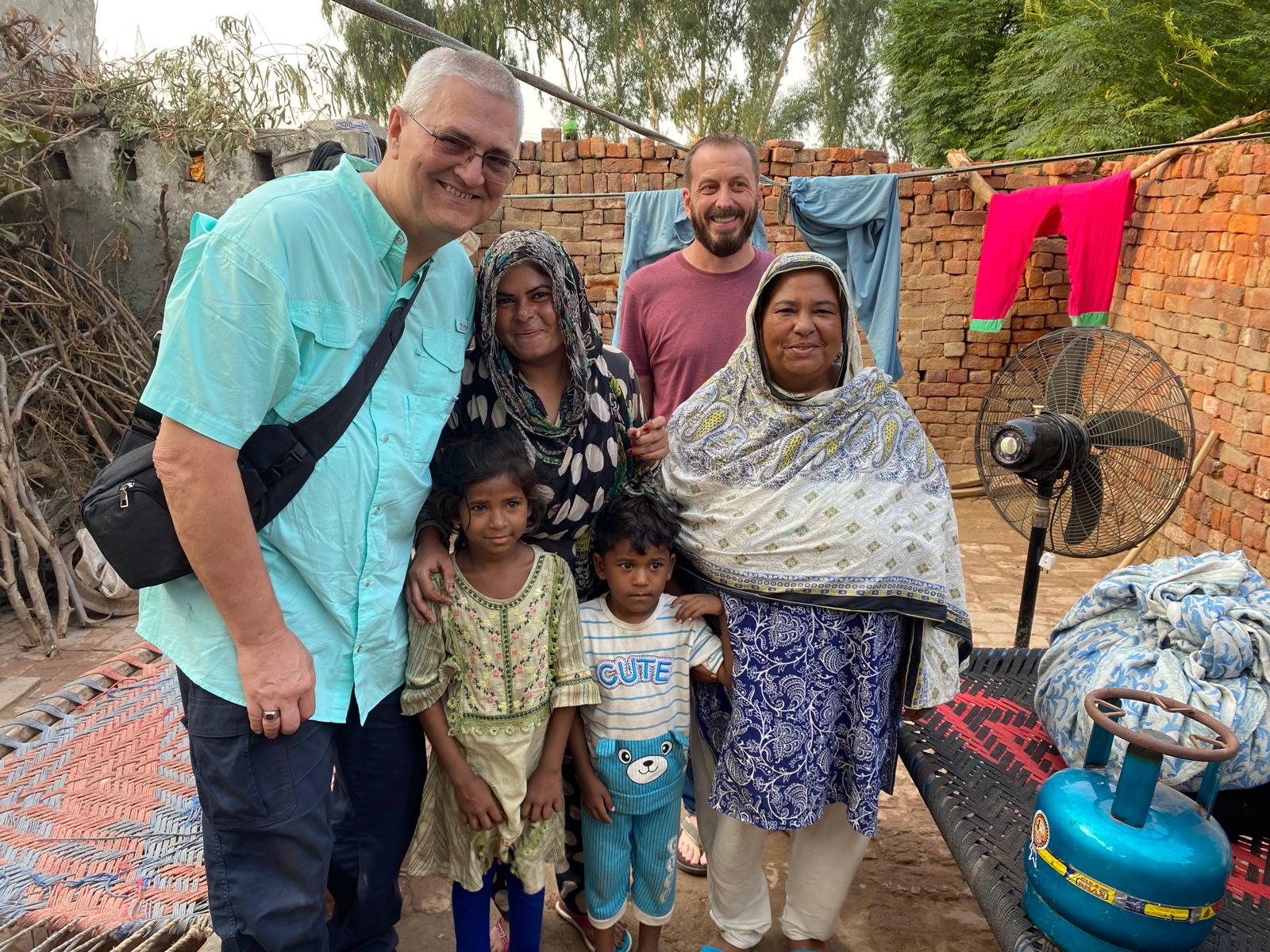 A freed family and ministry partners gathered outside their home in Pakistan